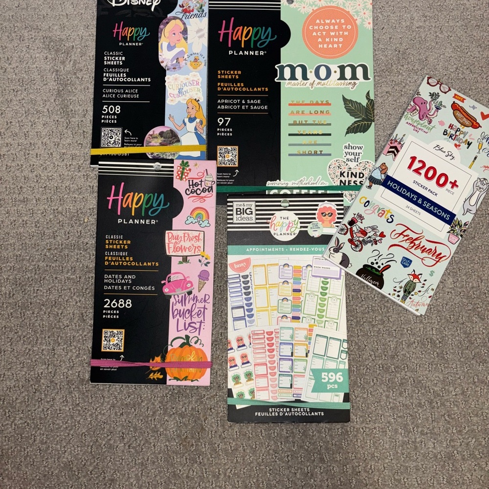 Four Used Happy Planner Sticker books with some fun surprises